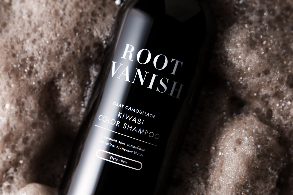 ROOT VANISH Gray Camouflage Kiwabi Color Shampoo bottle in Black on a textured wet surface
